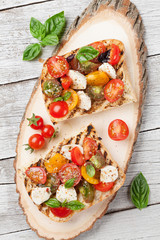 Bruschetta with tomatoes, mozzarella and basil