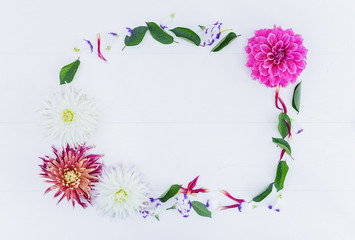 Frame of flowers with astra peony and leaves. Top view.