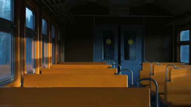 rays of light shimmer in an empty car with yellow seats