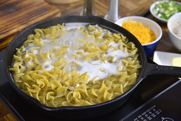 Egg noodles boiling