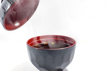 The black soup has little vegetables, the soup is tasteless.