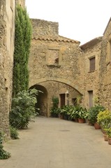 Fototapeta na wymiar Stone arches at passageway in Monells, Girona, Spain