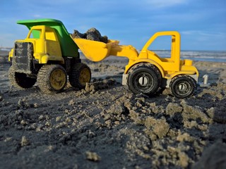 Dupmper and loader in the sand 