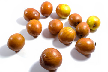 Jujube fruits close up on white background.