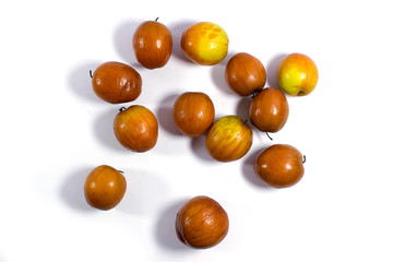 Jujube fruits close up on white background.