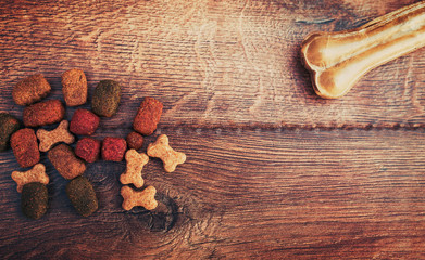 Pet accessories on wooden background. Top view. Pets and animals concept