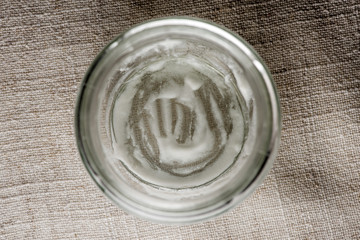 Empty yogurt jar on the table, the top view