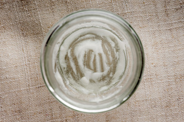 Empty yogurt jar on the table, the top view