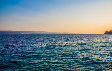 Obraz premium Rocky coastline with magical sunrise, Mimice, Croatia,Europe