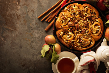 Cinnamon rolls with apples, caramel and pecan