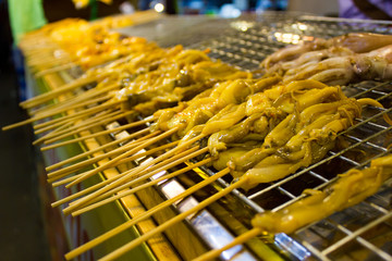 Fresh squid placed on a tray. Prairie bring to the grill.