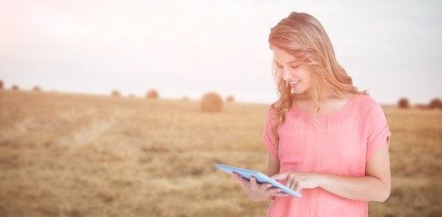 Composite image of hipster woman holding tablet pc