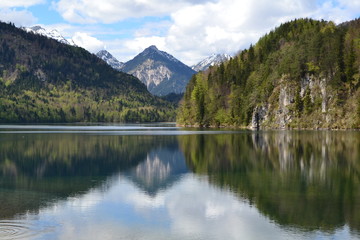 mountains reflecting beautifully in calm lake