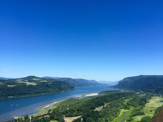 Oregon Landscape with its gorgeous rivers and mountains. Mother nature and its wonders. Nature background with sky, river and land. Simple earth backgrounds for presentations. 