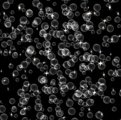 Soap bubbles and lights on a black background. Beautiful abstract background.