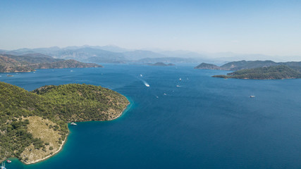 Obraz premium Aerial view of a beautiful coast with boats