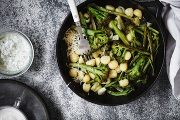 Gnocchi and broccolini serve up plates eating food concept 