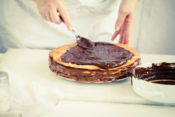 Chocolate layer cake Woman icing chocolate layer cake