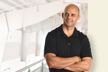 Fototapeta premium Businessman With Arms Crossed Smiling