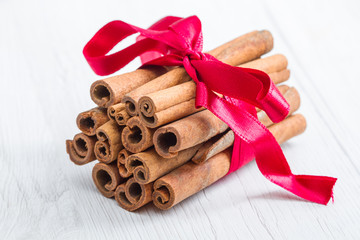 cinnamon stick with red ribbon