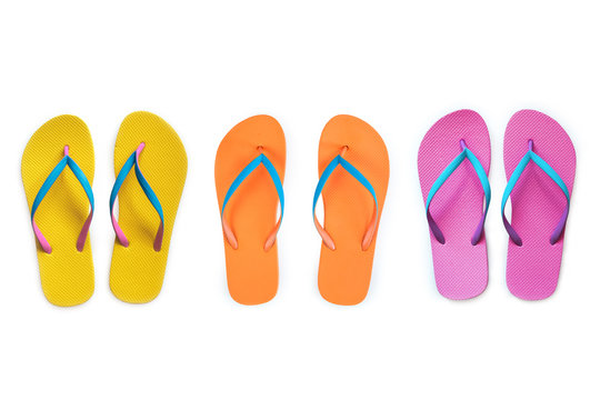 Yellow Orange Pink flip flops isolated on white background. Top view