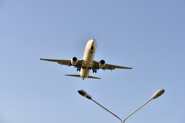 aircraft flies in the  sky view from below