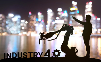 Silhouette of business man command automation robot arm machine technology , industry 4.0 ,...