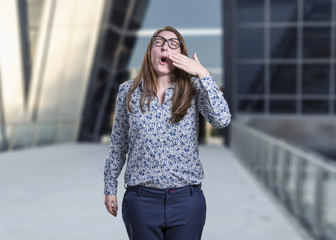 Fototapeta premium Pretty business woman making sleep gesture.