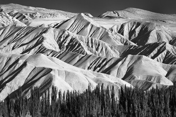 Mountain ranges on a plateau in Xinjiang, China, black and white landscape. 