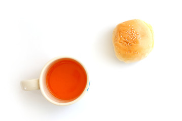 orange juice in cup and dessert on white background