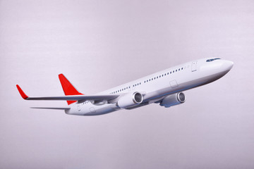 passenger plane on a gray background