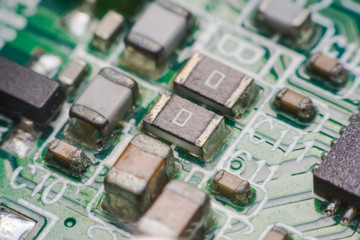 Closeup electronic hardware .Resistor and condensers assembly on the circuit board