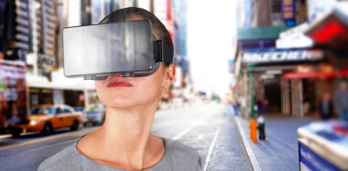 Composite image of close up of woman using virtual reality
