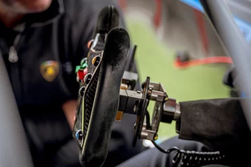 Foto op Canvas Black racing car steering wheel motorsport concept © fabioderby