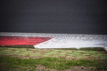 Gordijnen Motorsport racing track curb detail © fabioderby