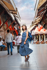 Young girl tourist walking in the old souvenir market in Istanbul, Turkey