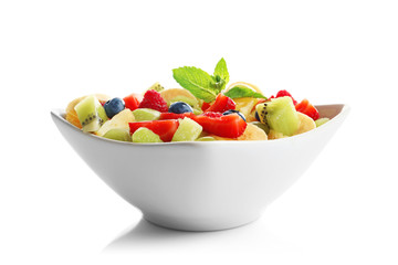 Bowl with yummy fruit salad, isolated on white