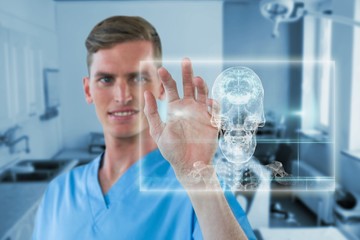 Fototapeta premium Composite image of happy male nurse touching invisible screen 3d