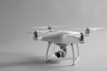 Modern quadcopter on color background