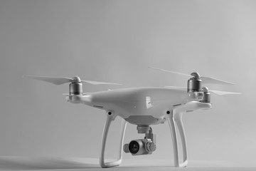 Modern quadcopter on color background