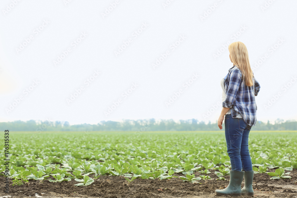 Sticker female farmer standing in field