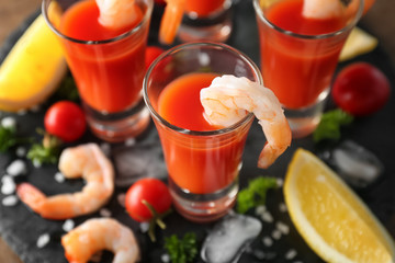 Shrimps and tomato sauce in glasses, closeup