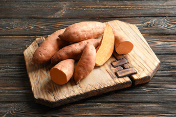 Sweet potatoes on wooden board