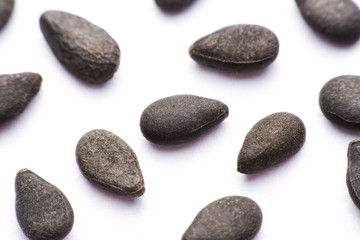 Close up pile of black sesame seeds isolated on white background