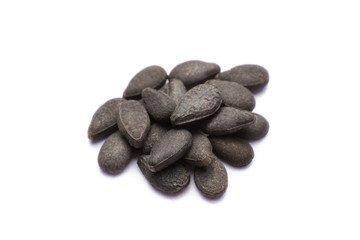 Close up pile of black sesame seeds isolated on white background