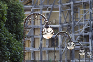 Street lights on the background of scaffolding