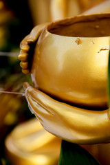 Hand of the Buddha holding an alms bowl. 