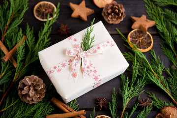 Christmas gift on the antique wooden background.