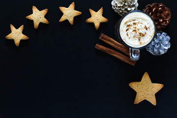 Christmas Hot Cocoa Drink with Whipped Cream Top Down View withGingerbread Star Cookies Pine Cones and Cinnamon Sticks 