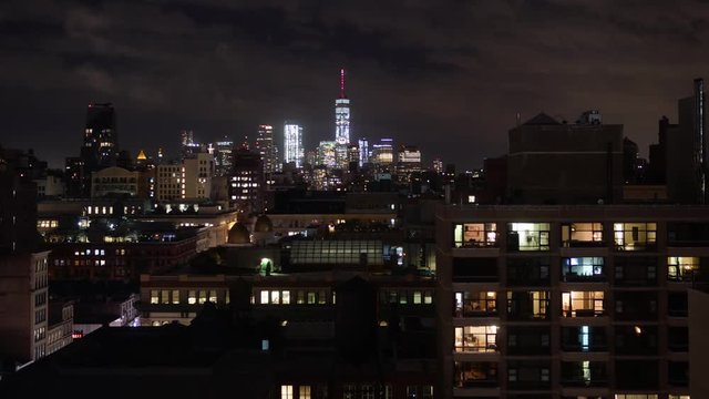 A dramatic nighttime time lapse view of lower Manhattan and the Freedom Tower.  	